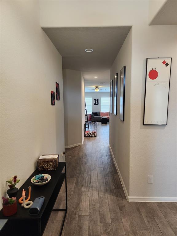 9240 Castorian Drive Fort Worth, TX 76131 - Photo 2 of 40 a hallway with furniture and wooden floor