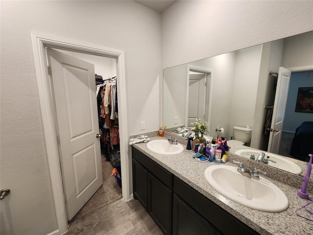 9240 Castorian Drive Fort Worth, TX 76131 - Photo 23 of 40 a bathroom with a double vanity sink and mirror