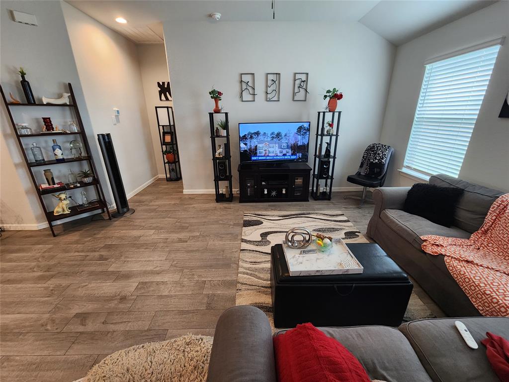 9240 Castorian Drive Fort Worth, TX 76131 - Photo 33 of 40 a living room with furniture and a flat screen tv