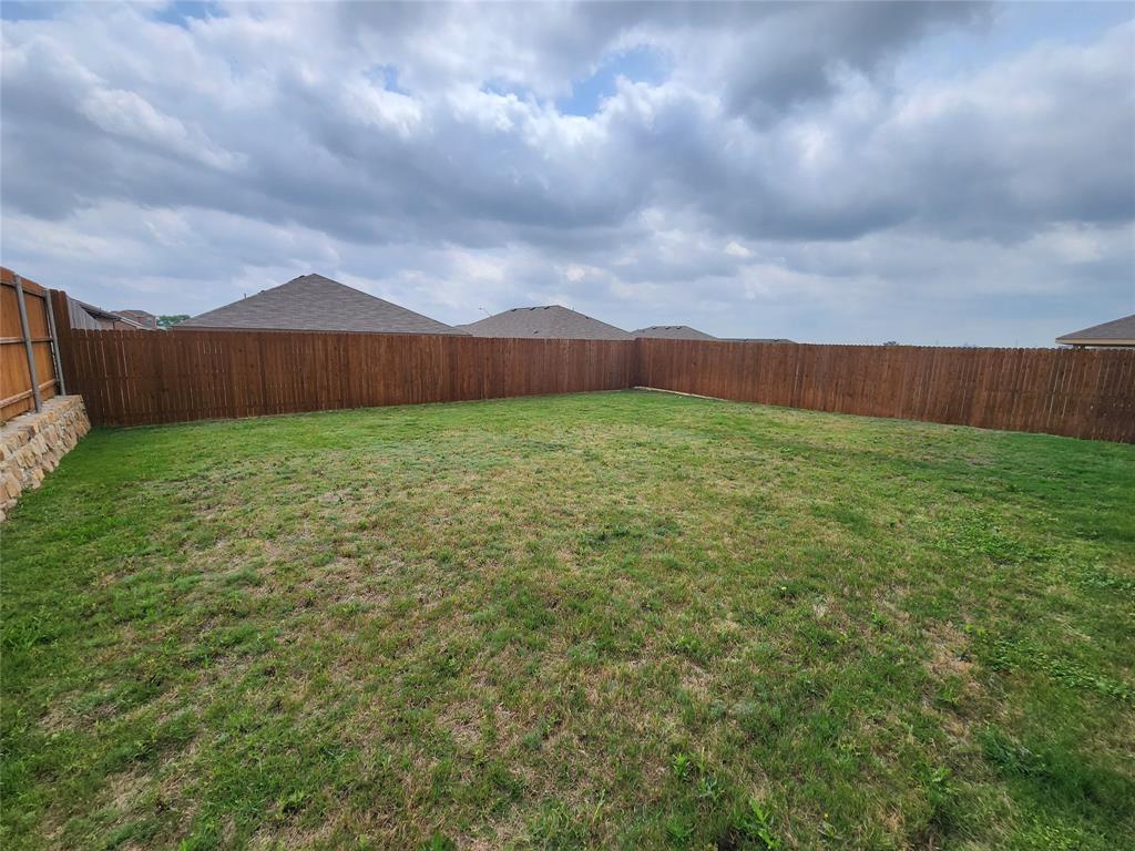 9240 Castorian Drive Fort Worth, TX 76131 - Photo 36 of 40 a view of a big yard with wooden fence