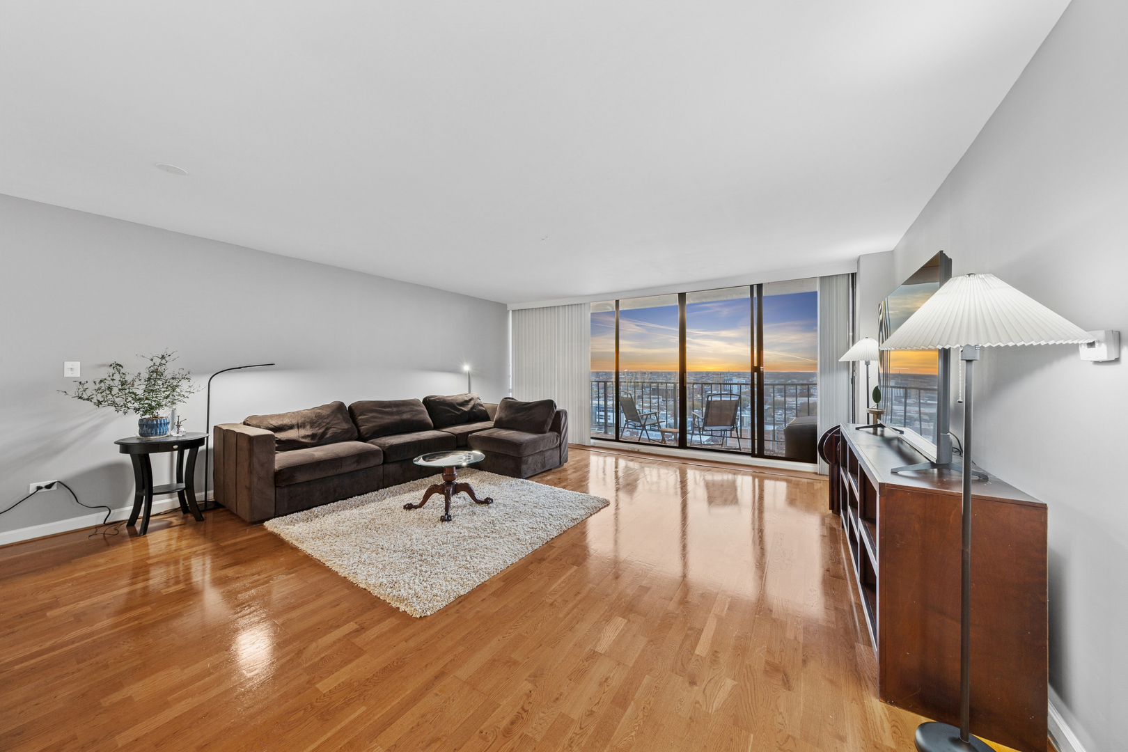3150 North Sheridan Road, Unit 25CD Chicago, IL 60657 - Photo 2 of 28 a living room with furniture and a wooden floor