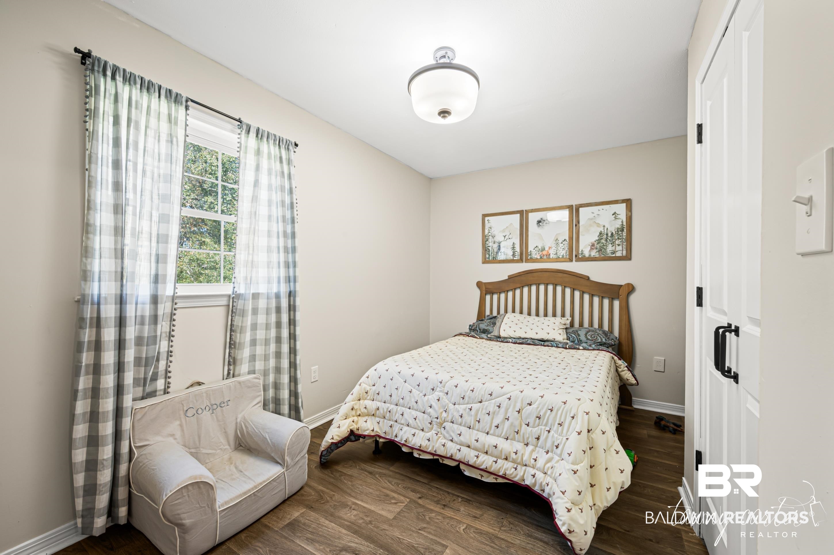 3086 Wild Fork Road Frisco City, AL 36445 - Photo 12 of 30 Bedroom with wood finished floors and baseboards