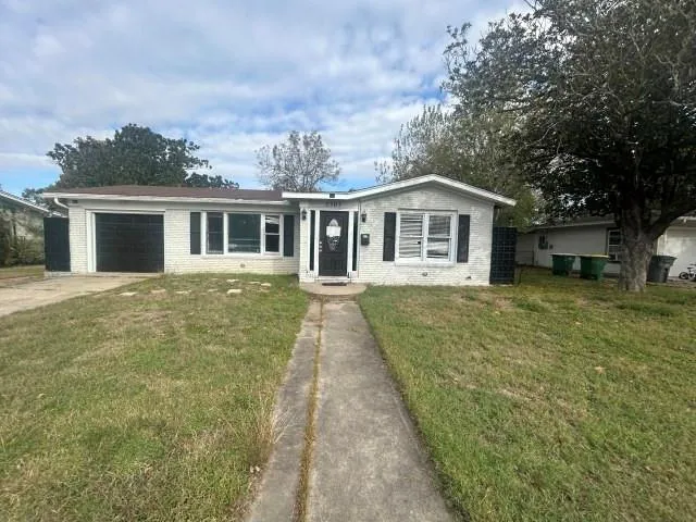 front view of a house with a yard