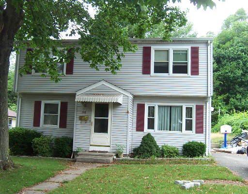 a view of a house with a yard