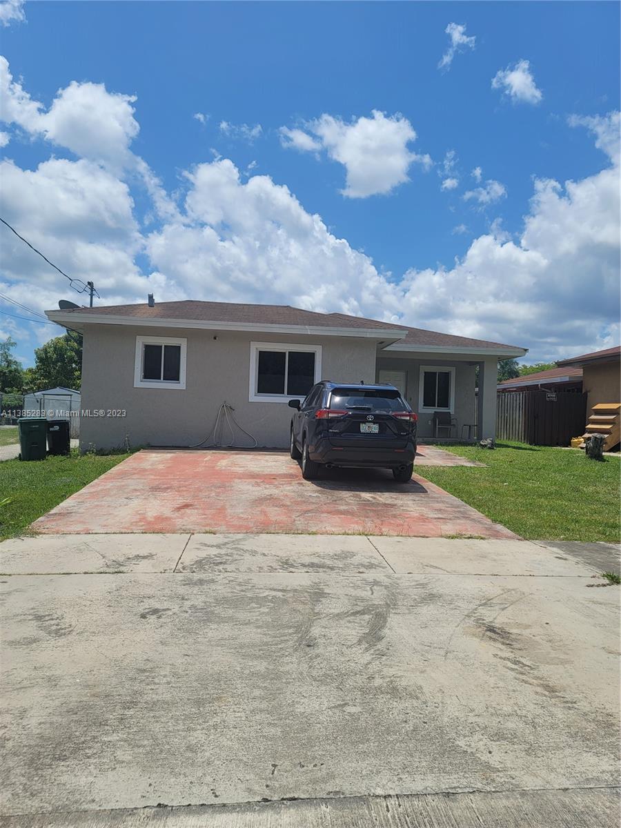 a view of house with yard and entertaining space