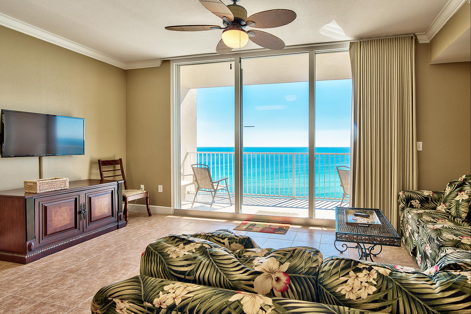 a spacious bedroom with a large bed and a flat screen tv