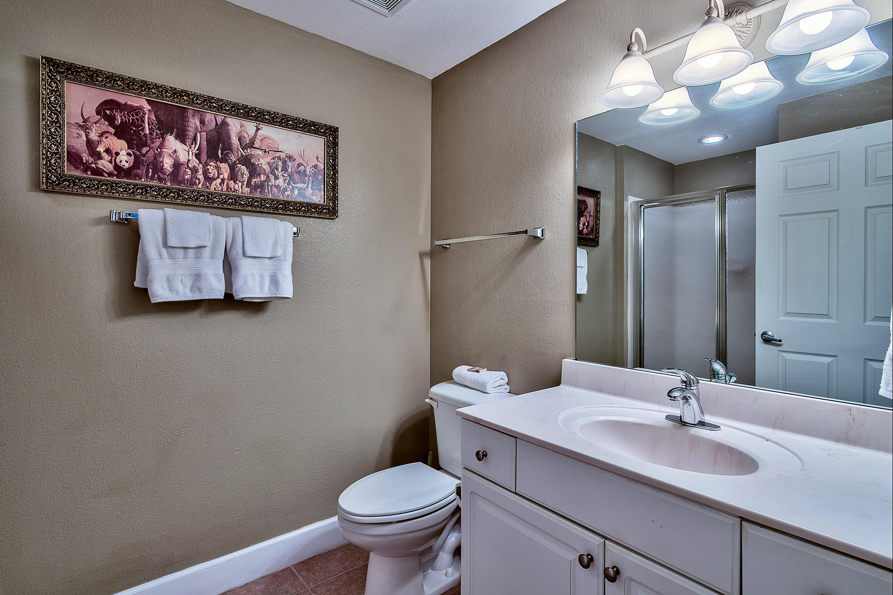 16819 Front Beach Road, Unit 1110 Panama City Beach, FL 32413 - Photo 15 of 34 a bathroom with a toilet sink and mirror