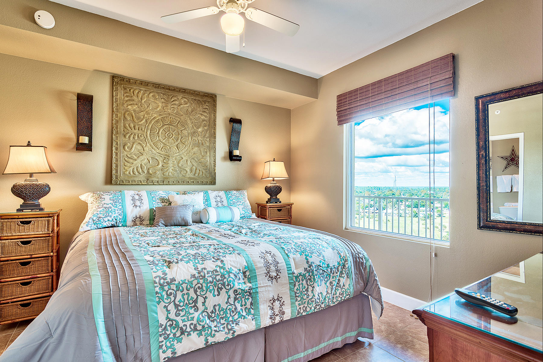 16819 Front Beach Road, Unit 1110 Panama City Beach, FL 32413 - Photo 7 of 34 a bedroom with a bed and large windows