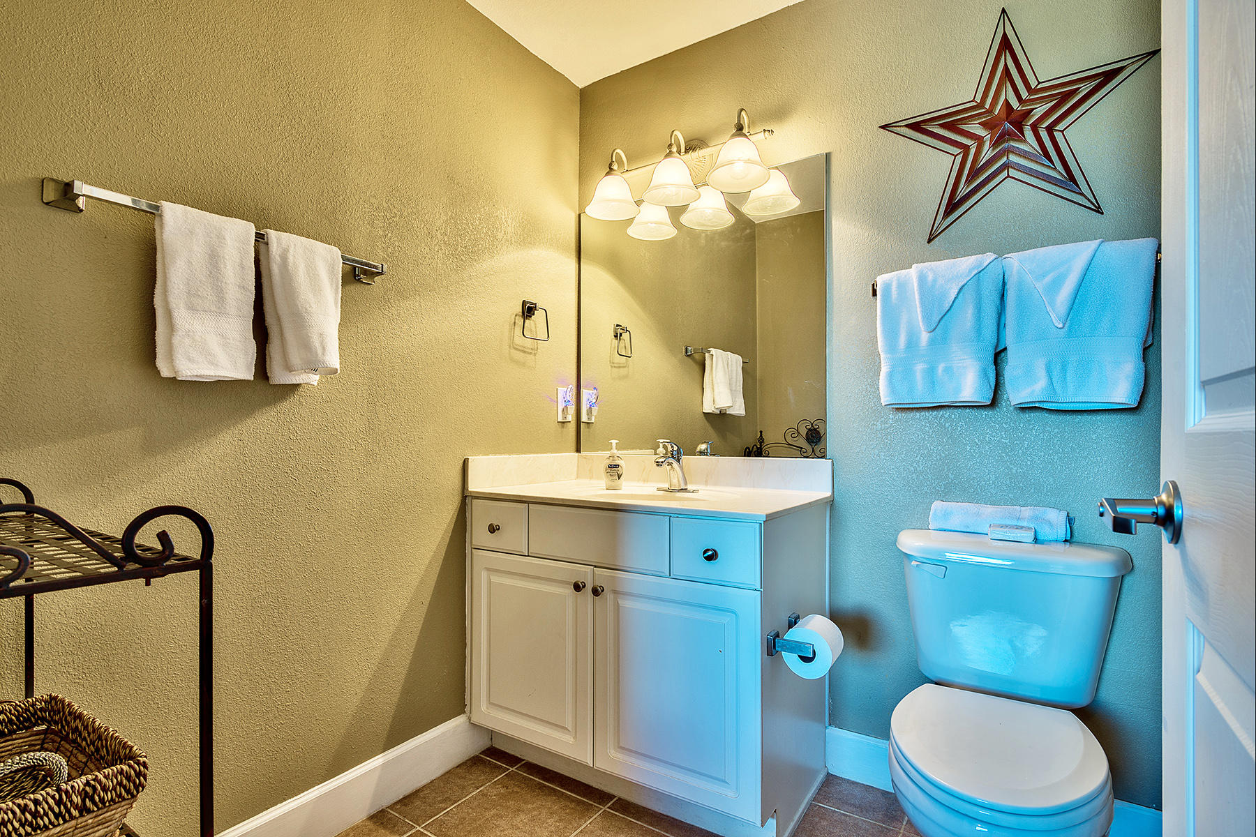 16819 Front Beach Road, Unit 1110 Panama City Beach, FL 32413 - Photo 9 of 34 a bathroom with a toilet a sink and mirror