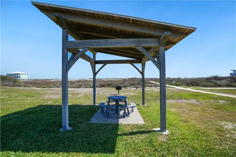 a view of a room with a table and chairs