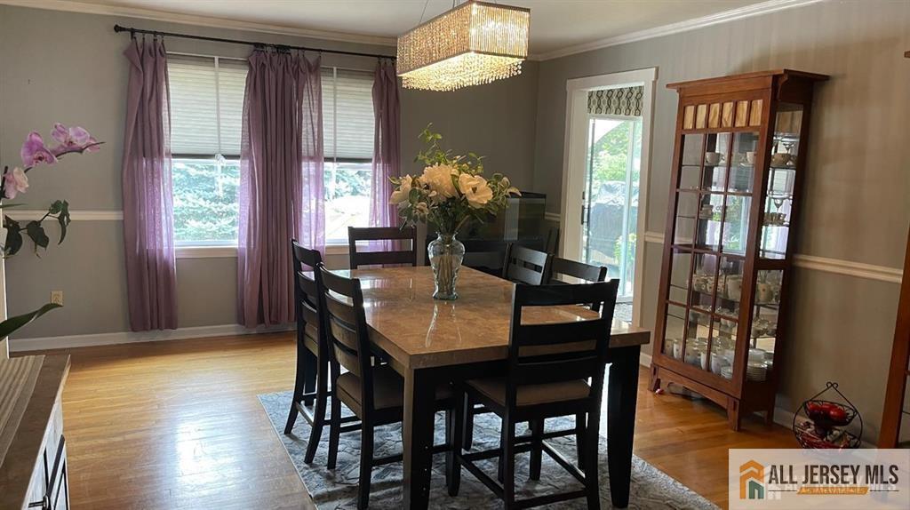 102 Gracey Street Edison, NJ 08817 - Photo 6 of 16 a dining room with furniture and wooden floor