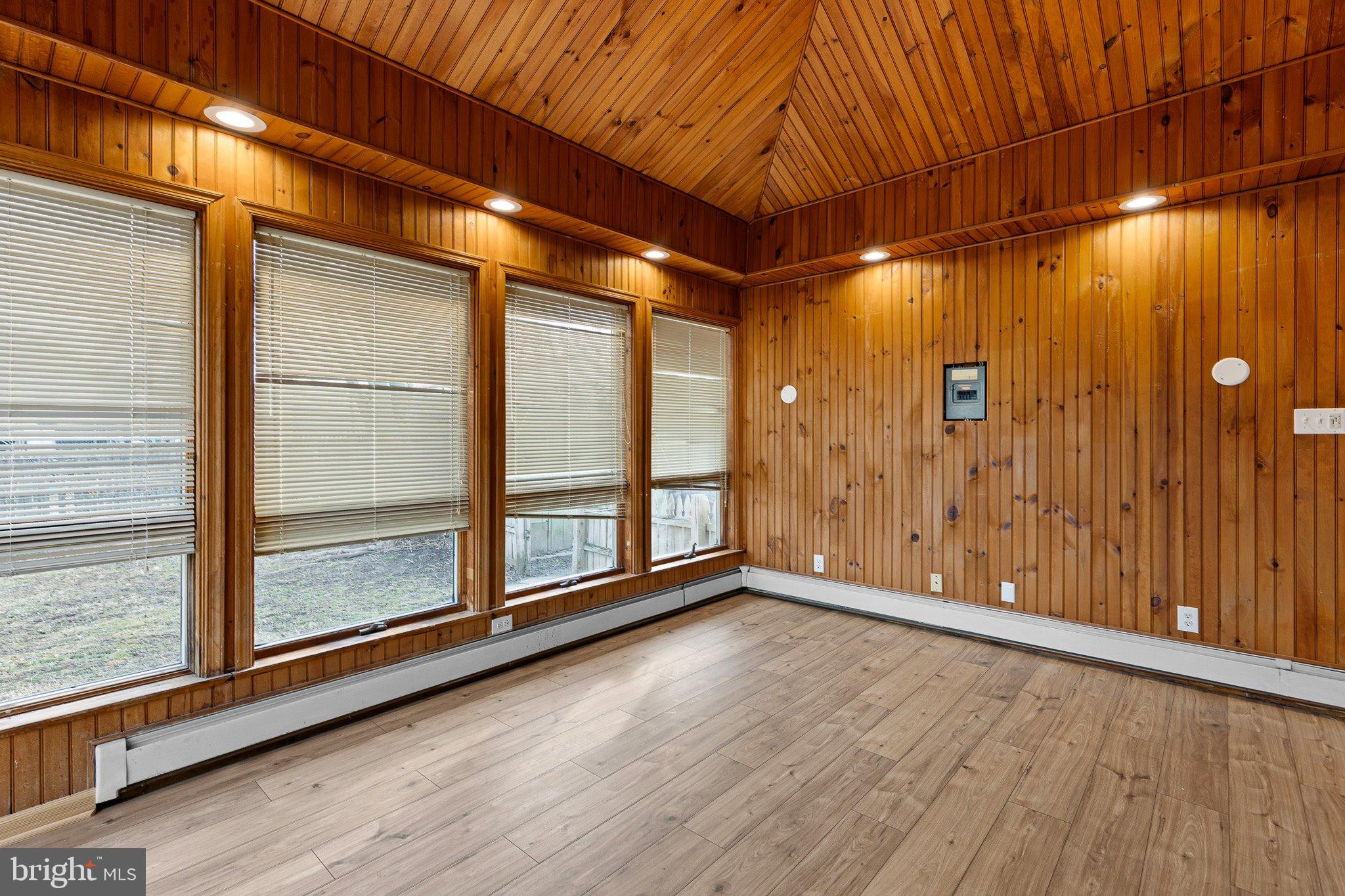 15 Irwin Avenue New Castle, DE 19720 - Photo 11 of 29 a view of an empty room with wooden floor and a window