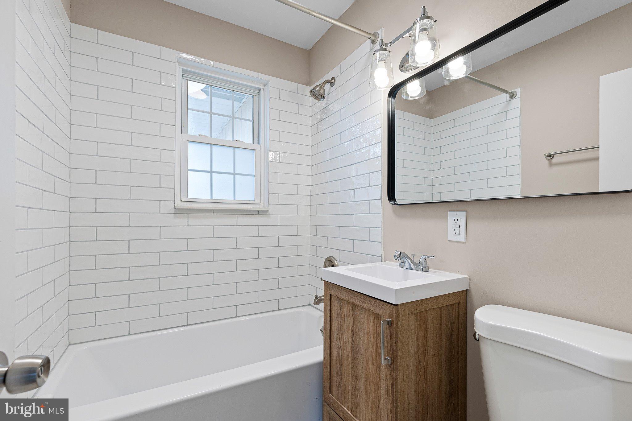15 Irwin Avenue New Castle, DE 19720 - Photo 12 of 29 a bathroom with a sink toilet and shower