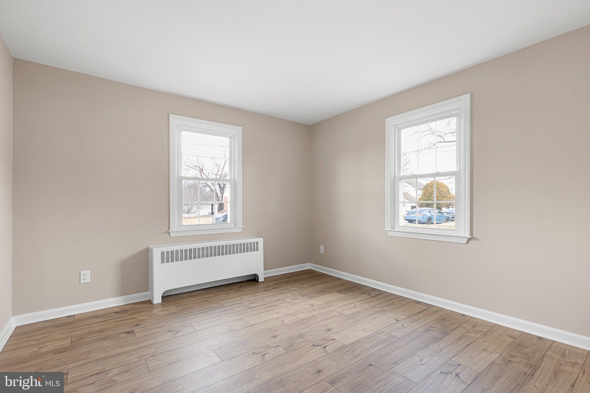15 Irwin Avenue New Castle, DE 19720 - Photo 13 of 29 wooden floor in an empty room with a window