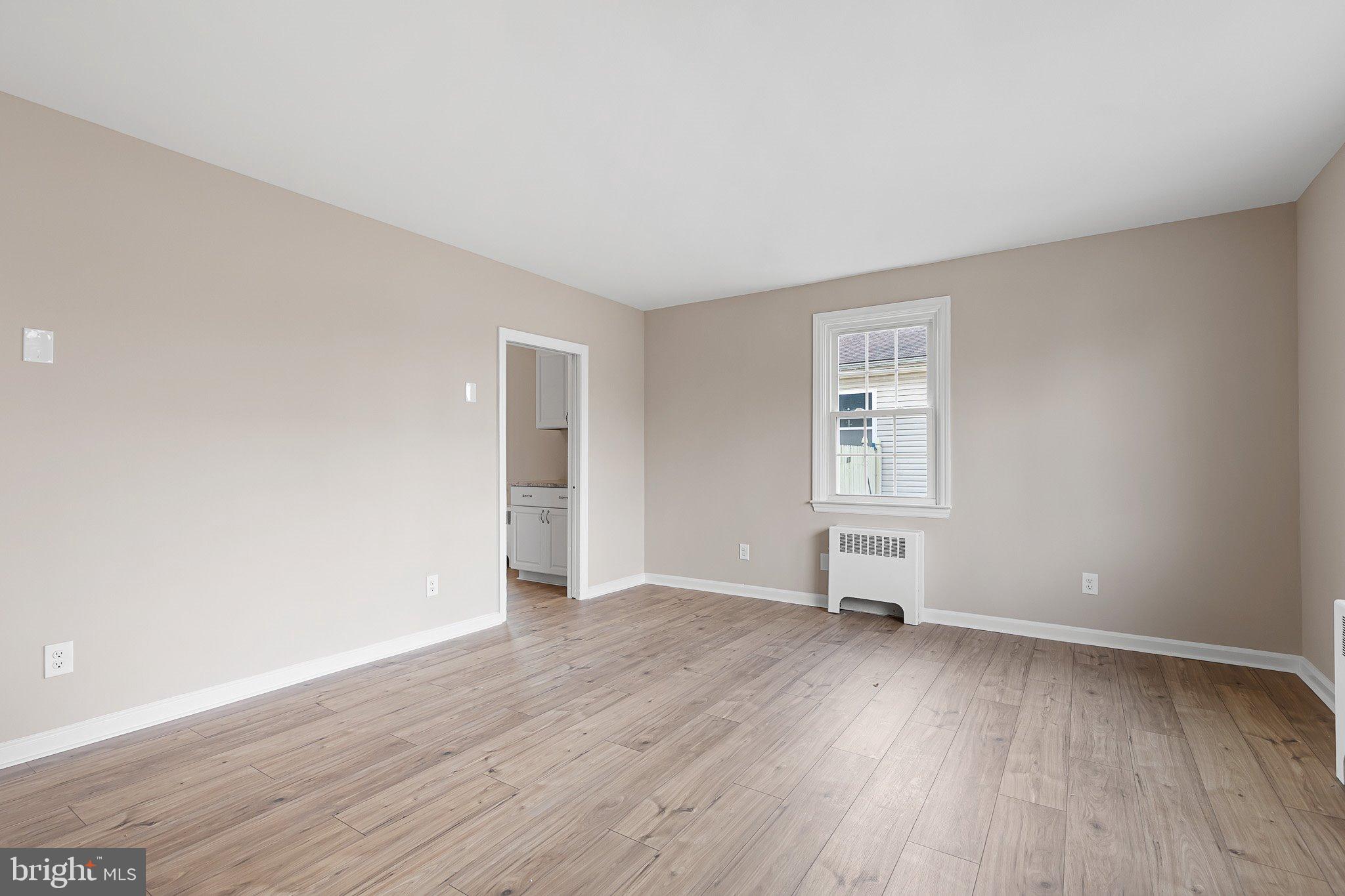 15 Irwin Avenue New Castle, DE 19720 - Photo 15 of 29 an empty room with wooden floor and windows