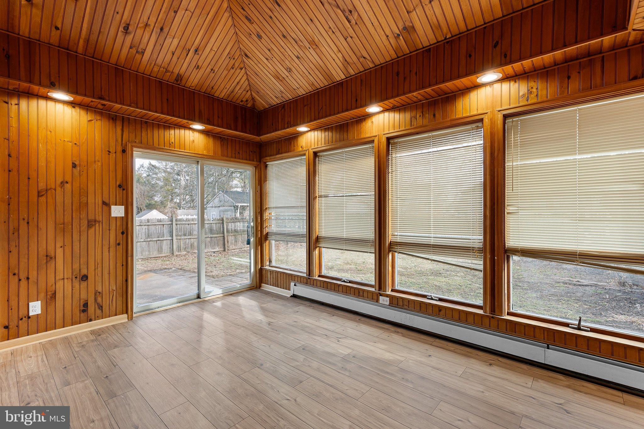 15 Irwin Avenue New Castle, DE 19720 - Photo 9 of 29 a view of an empty room with wooden floor and a window