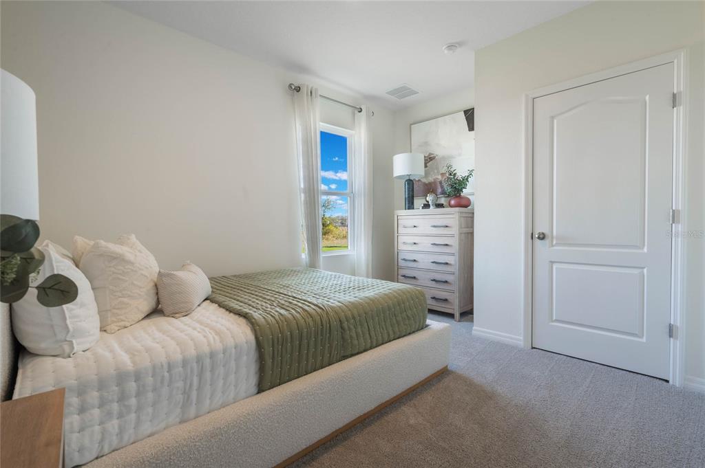 3441 Nettle Loop Tavares, FL 32778 - Photo 17 of 29 a bedroom with a bed and a window