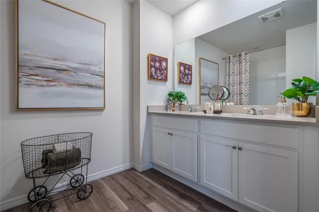 a room with cabinets and wooden floor