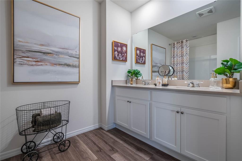 3441 Nettle Loop Tavares, FL 32778 - Photo 21 of 29 a room with cabinets and wooden floor