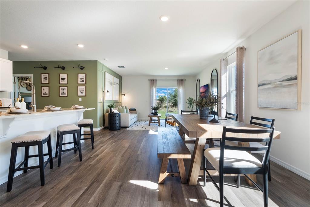 3441 Nettle Loop Tavares, FL 32778 - Photo 3 of 29 a view of a dining room with furniture window and wooden floor