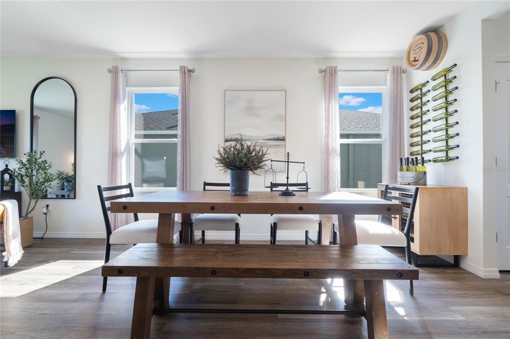 3441 Nettle Loop Tavares, FL 32778 - Photo 4 of 29 a view of a dining room with furniture and window