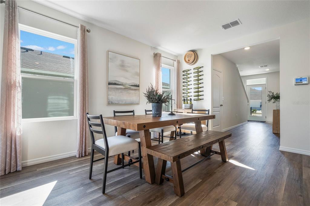 3441 Nettle Loop Tavares, FL 32778 - Photo 5 of 29 a view of a dining room with furniture window and wooden floor