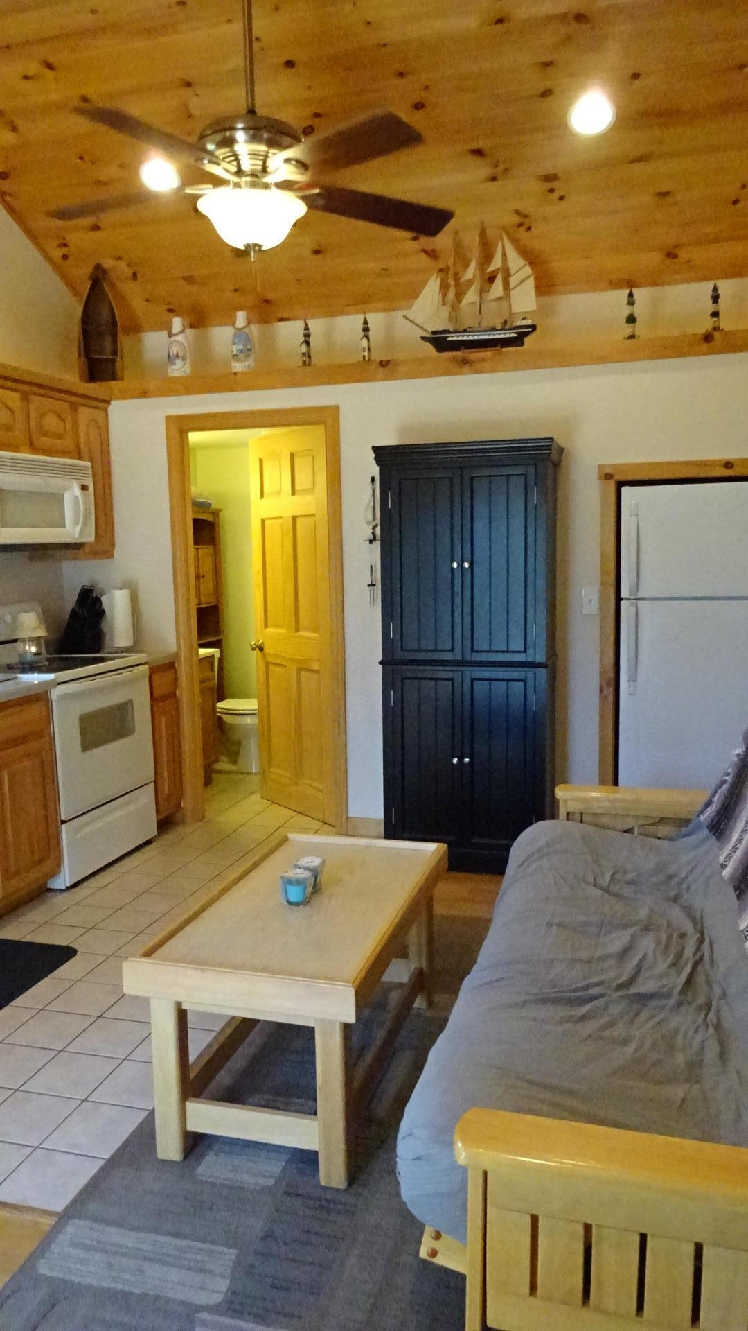 2032 State Highway Route Wellfleet, MA 02667 - Photo 13 of 33 a spacious bedroom with a bed and a table