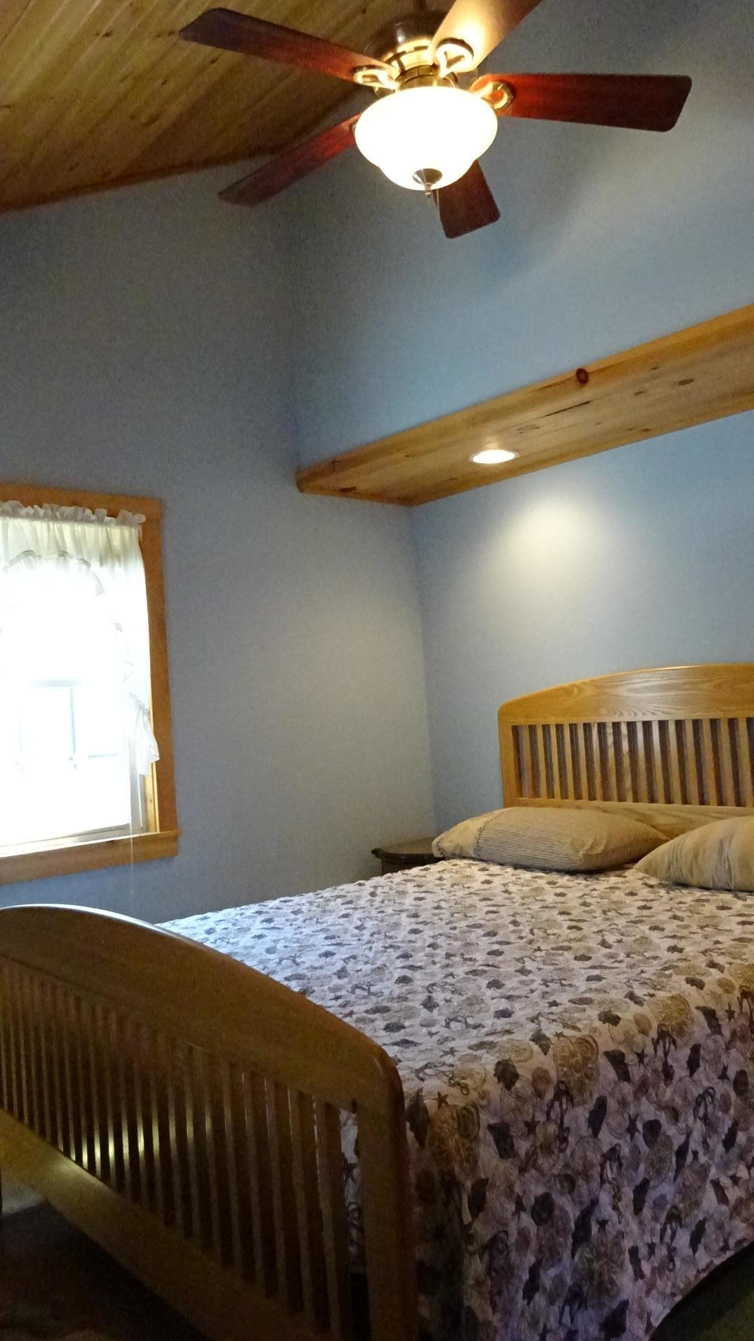 2032 State Highway Route Wellfleet, MA 02667 - Photo 23 of 33 a bedroom with a bed and a window