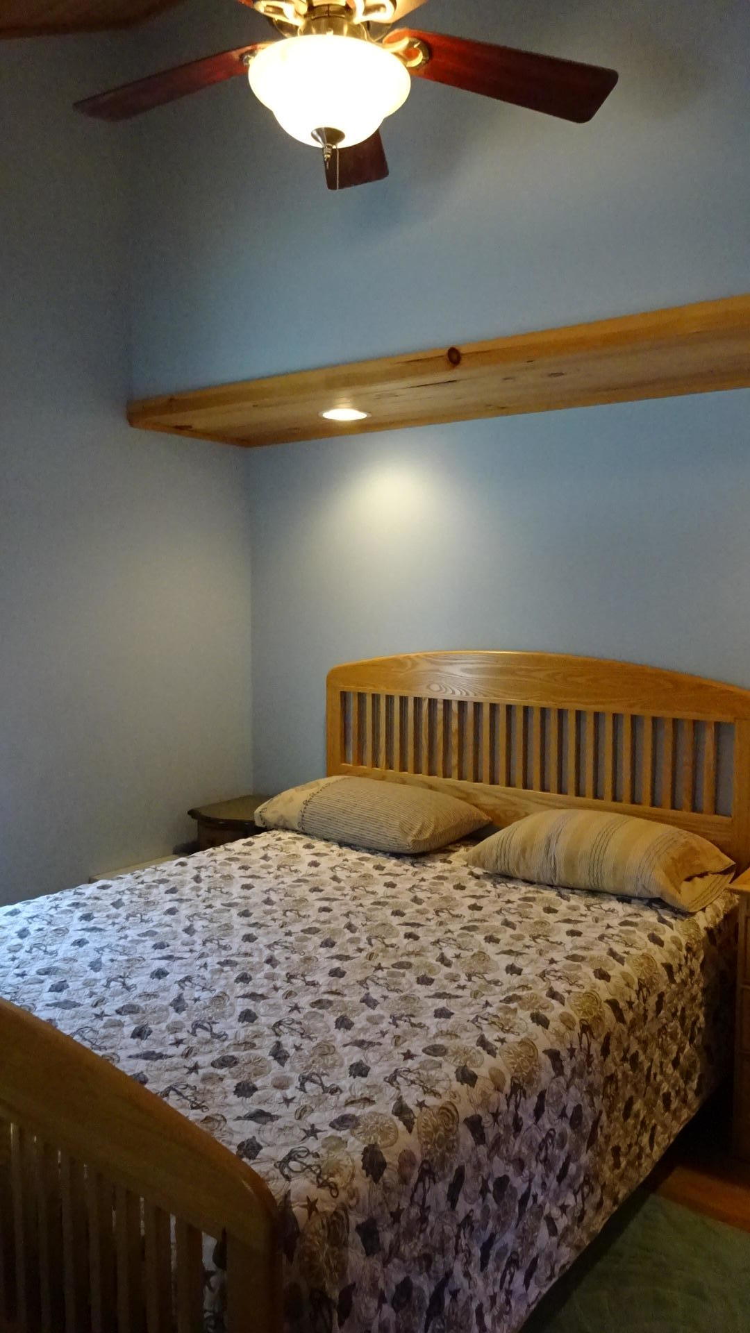 2032 State Highway Route Wellfleet, MA 02667 - Photo 24 of 33 a large bed sitting in a bedroom next to a lamp