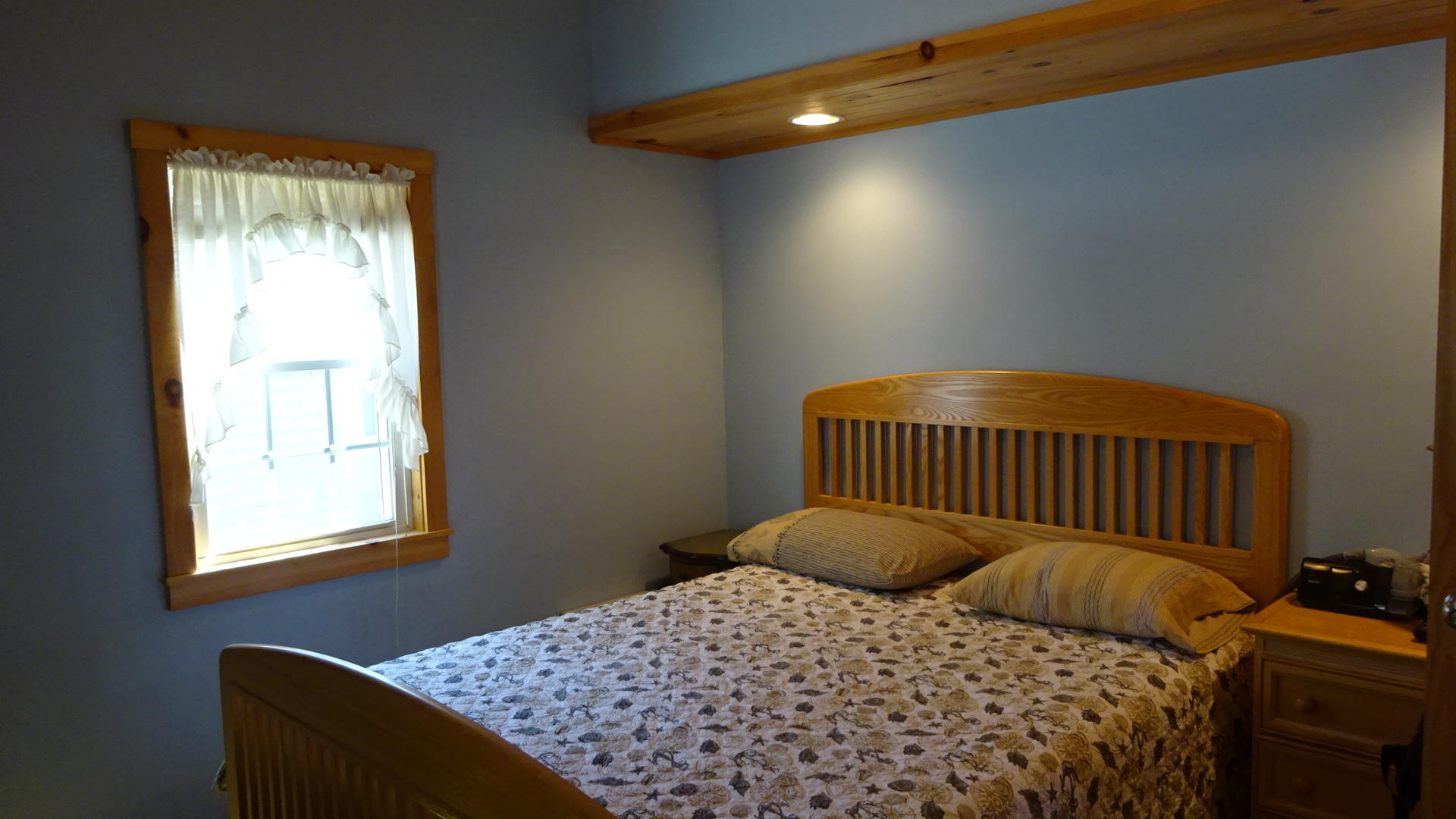 2032 State Highway Route Wellfleet, MA 02667 - Photo 25 of 33 a bedroom with a bed and window