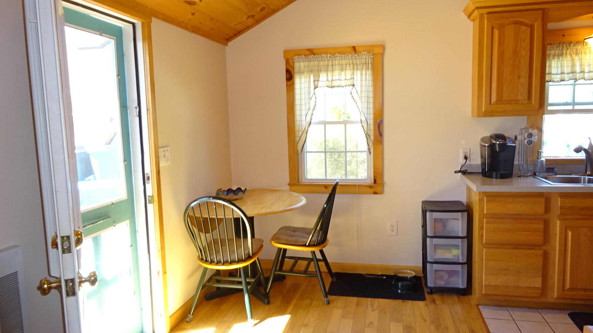 2032 State Highway Route Wellfleet, MA 02667 - Photo 8 of 33 a view of a dining room with furniture and windows