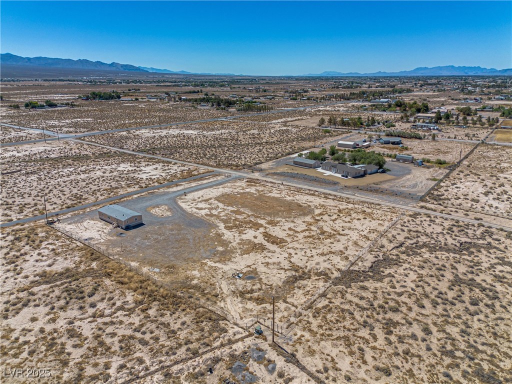 2150 West Harris Farm Road Pahrump, NV 89060 - Photo 33 of 33 View of rural area featuring a desert landscape and a mountain backdrop