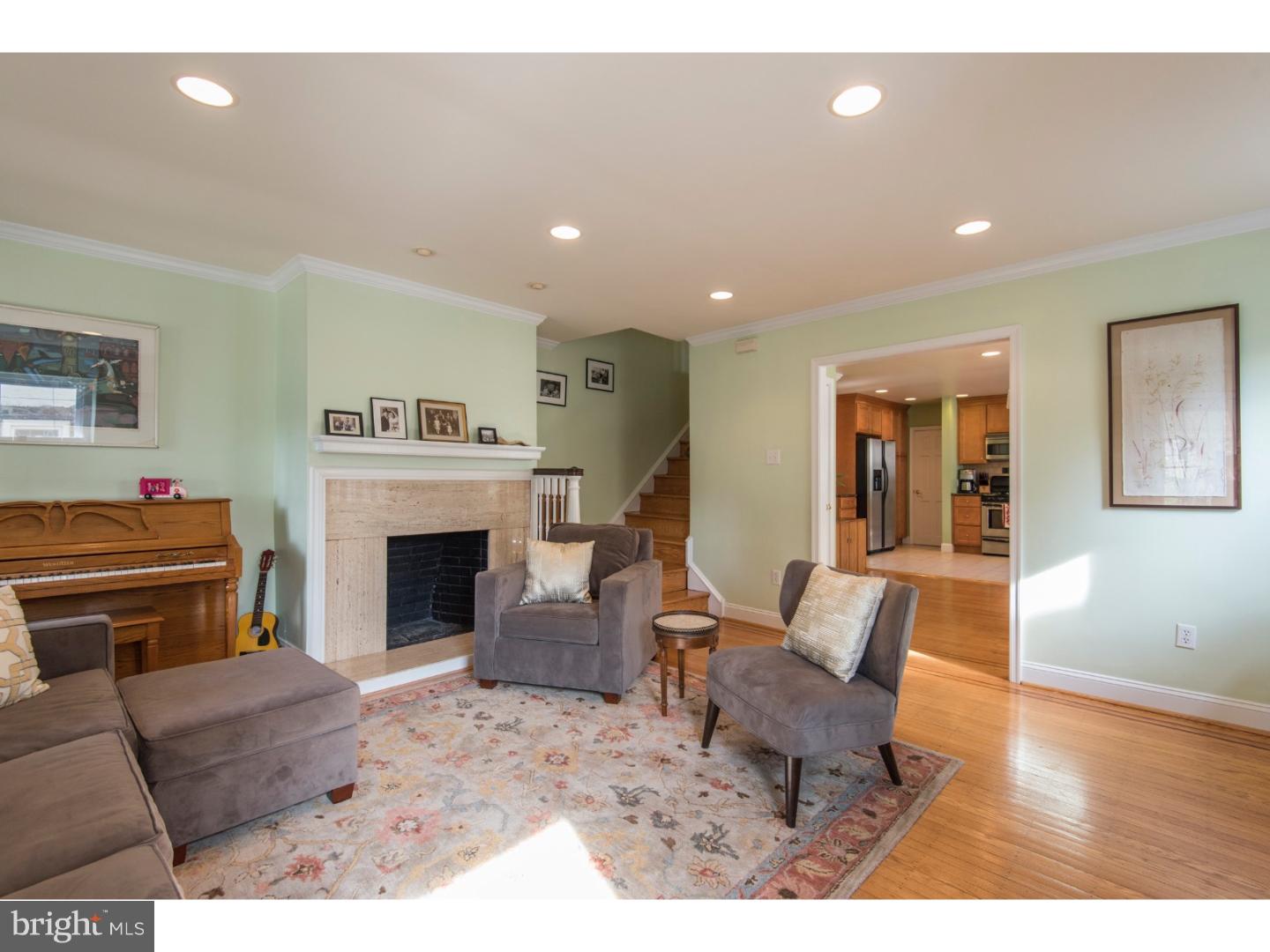 517 Valley-View Road Merion Station, PA 19066 - Photo 5 of 24 a living room with furniture a fireplace and a flat screen tv
