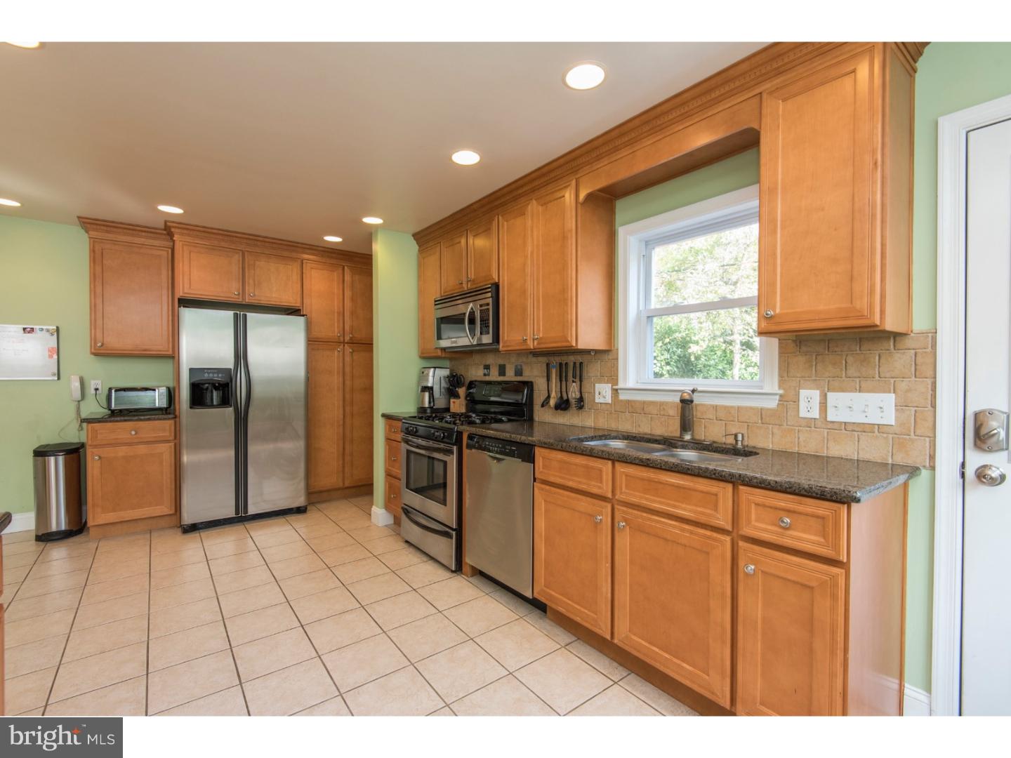 517 Valley-View Road Merion Station, PA 19066 - Photo 6 of 24 a kitchen with stainless steel appliances a refrigerator sink and cabinets