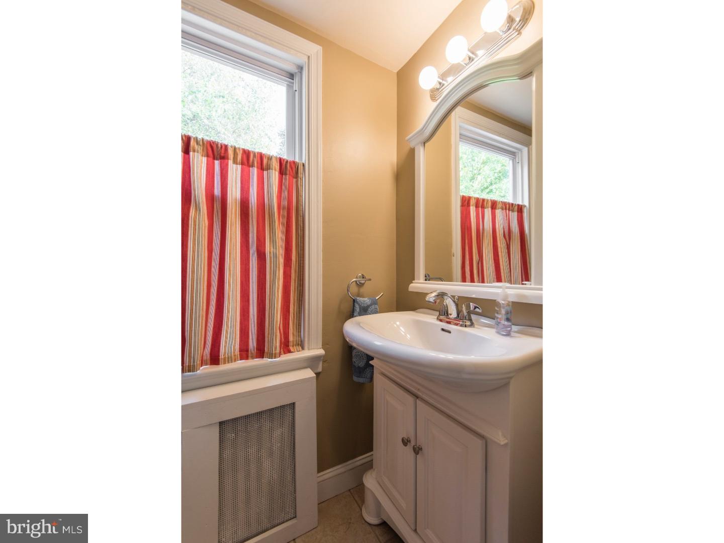 517 Valley-View Road Merion Station, PA 19066 - Photo 10 of 24 a bathroom with a sink and a mirror