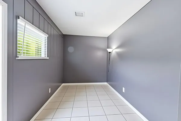 a bathroom with a granite countertop sink a toilet and mirror