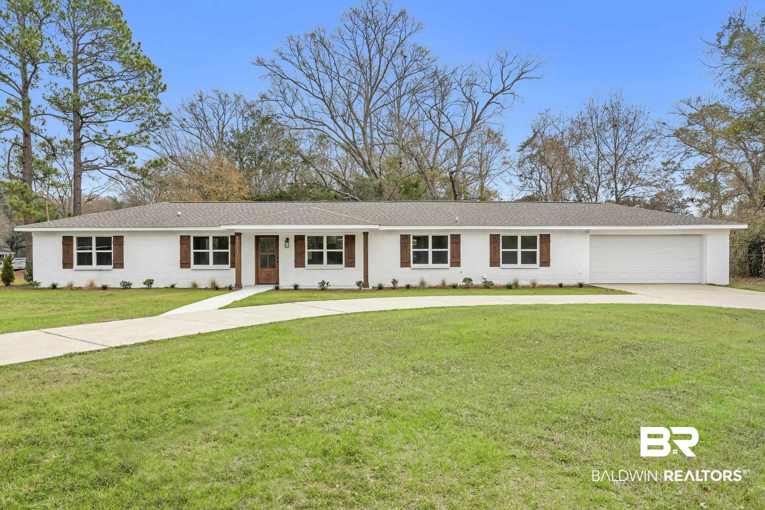 11381 Normandy Drive East Semmes, AL 36575 - Photo 1 of 23 Ranch-style house featuring driveway, a front lawn, and an attached garage