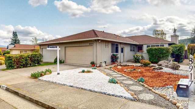 a front view of house with yard outdoor seating and barbeque oven