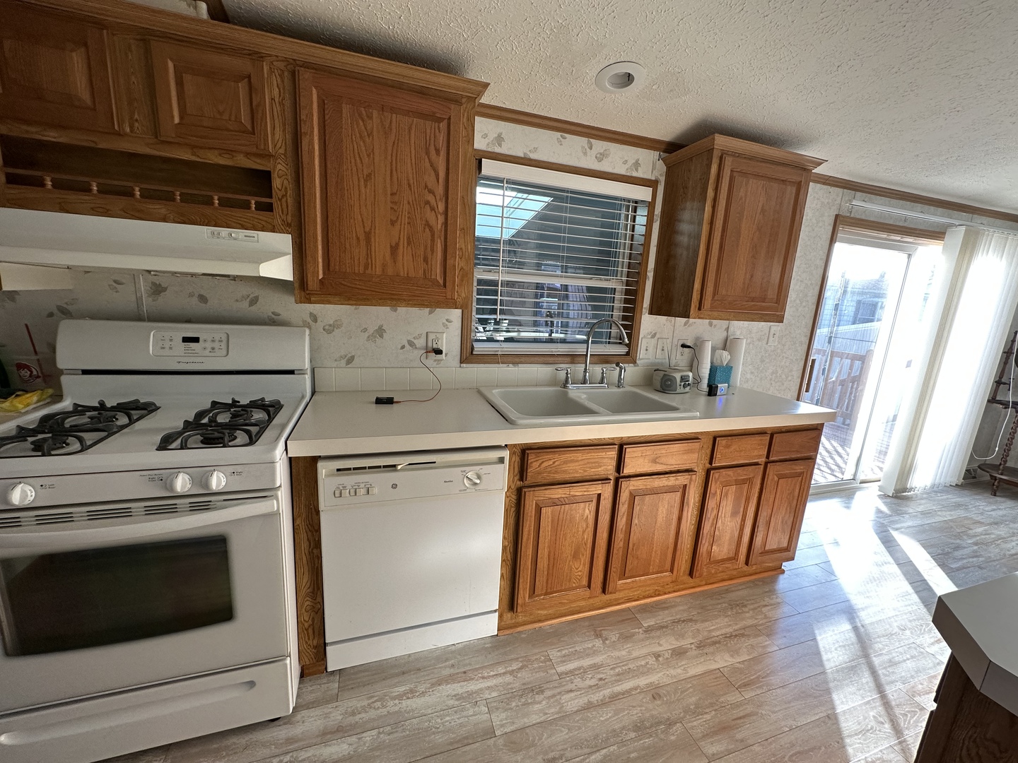 286 Blackthorn Road Matteson, IL 60443 - Photo 14 of 28 a kitchen with stainless steel appliances granite countertop a stove a sink and a microwave