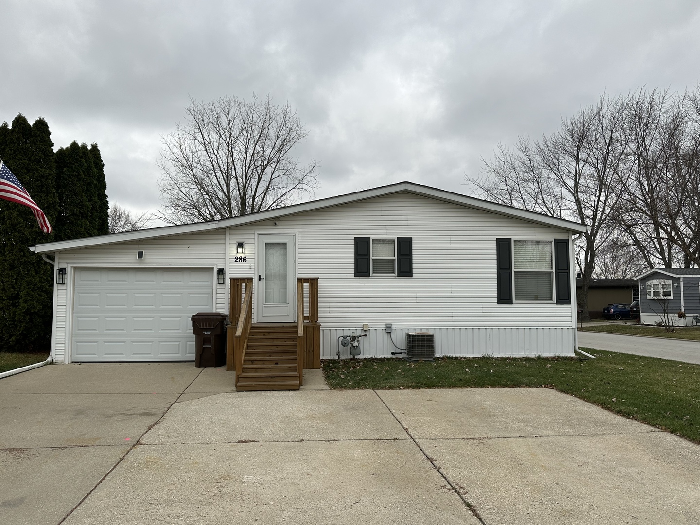286 Blackthorn Road Matteson, IL 60443 - Photo 28 of 28 a view of a white house with a yard