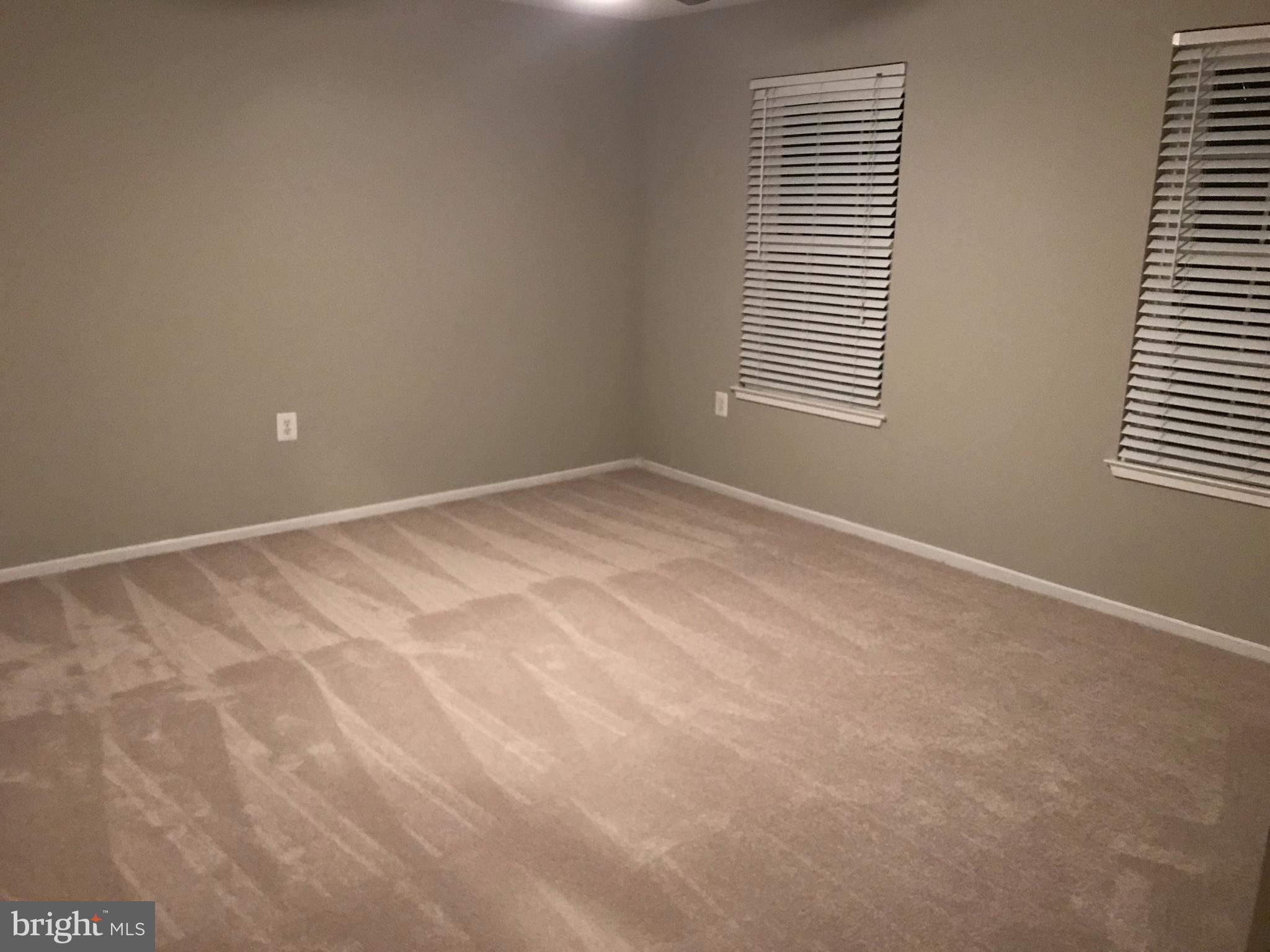 7702 Lexton Place, Unit 65 Springfield, VA 22152 - Photo 19 of 24 a view of an empty room with a window