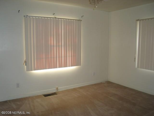 2509 Gayland Road Jacksonville, FL 32218 - Photo 5 of 8 an empty room with a window