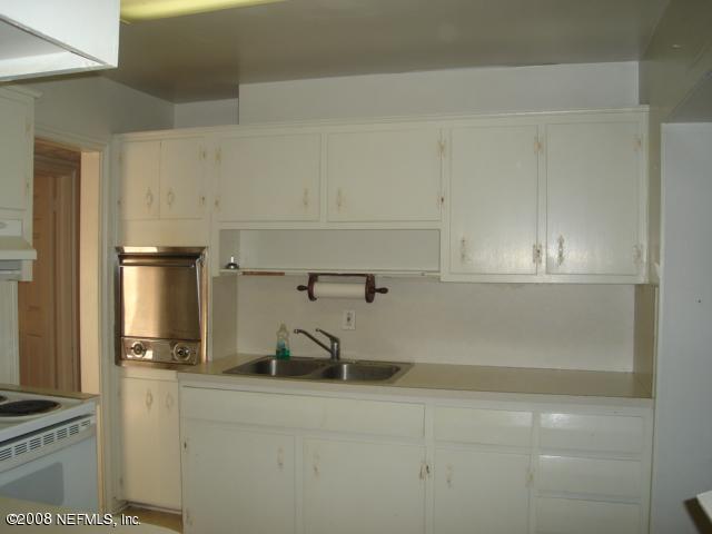 2509 Gayland Road Jacksonville, FL 32218 - Photo 8 of 8 a kitchen with a sink and cabinets