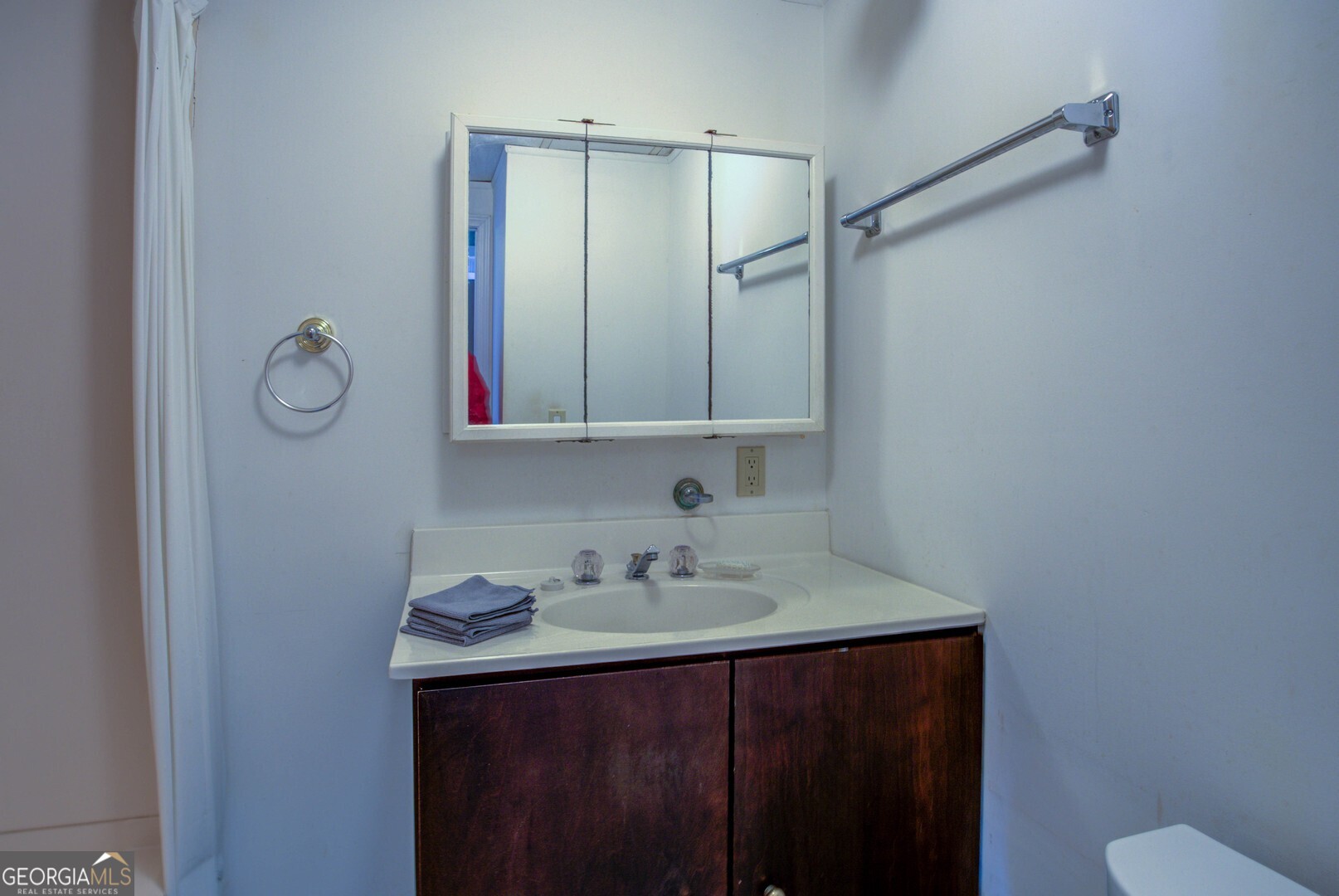 3825 North Goddard Road Lithonia, GA 30038 - Photo 22 of 36 a bathroom with a sink vanity and mirror