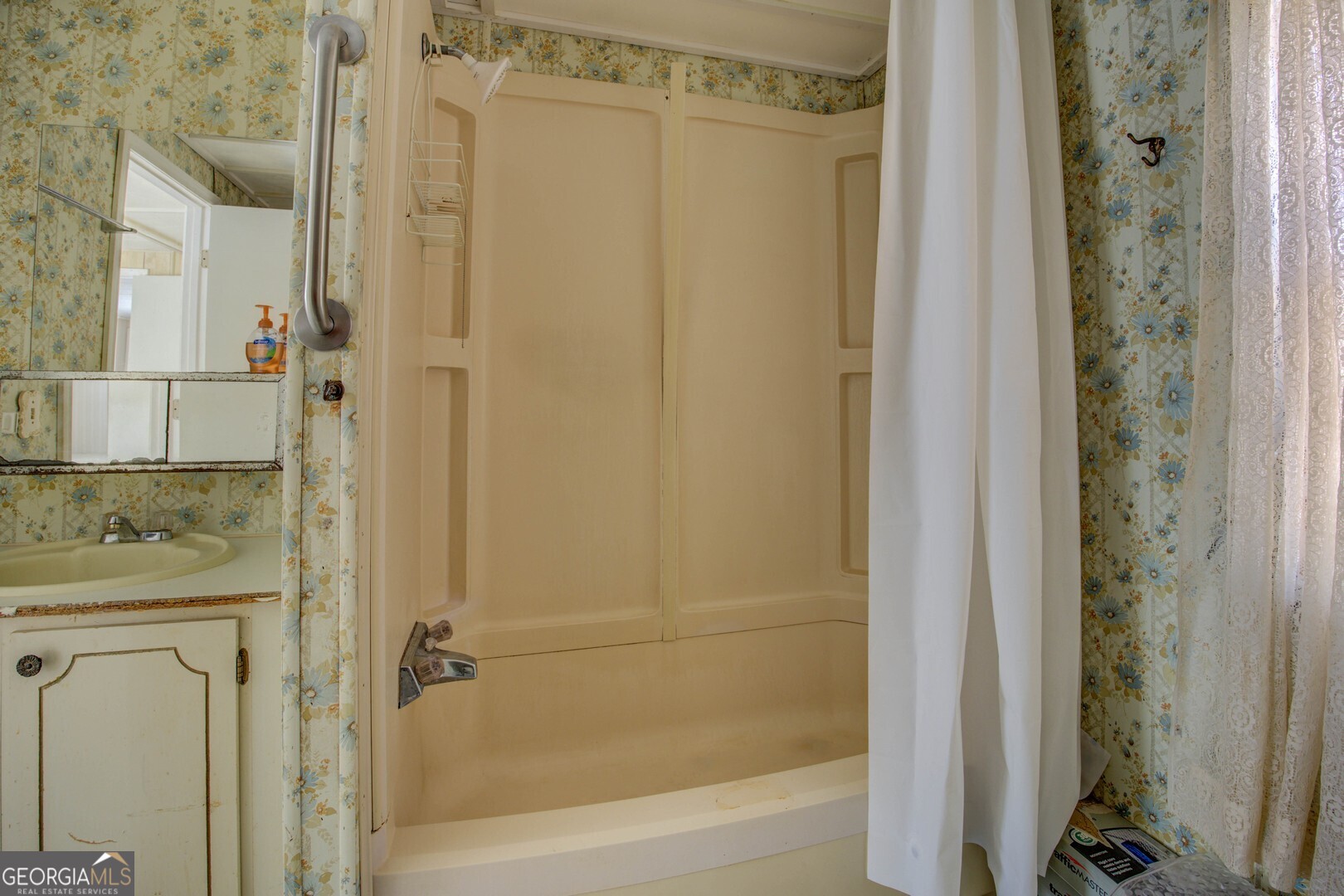 3825 North Goddard Road Lithonia, GA 30038 - Photo 27 of 36 a bathroom with a shower and a sink