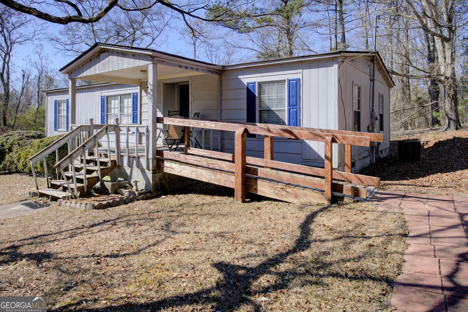 3825 North Goddard Road Lithonia, GA 30038 - Photo 33 of 36 a view of a house with a yard covered in snow