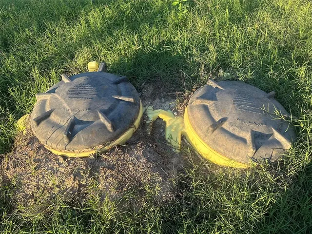 a view of a swimming pool with a yard
