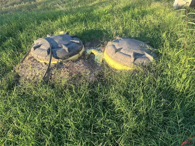 an aerial view of a house with yard swimming pool and outdoor seating