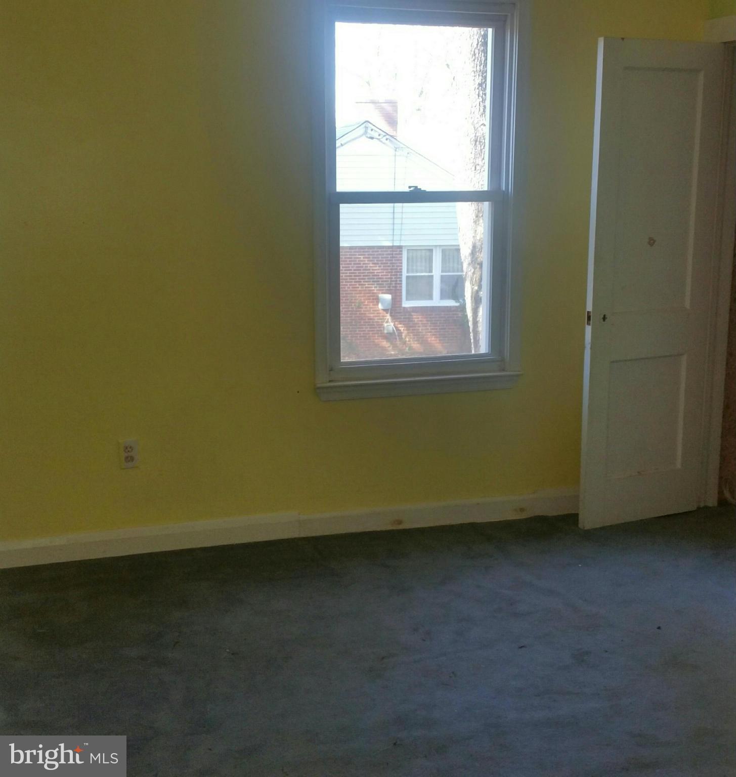 8611 Inwood Road Baltimore, MD 21244 - Photo 4 of 23 an empty room with a window
