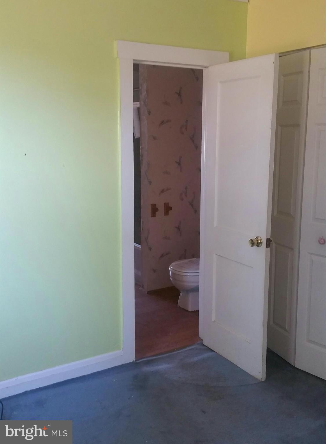 8611 Inwood Road Baltimore, MD 21244 - Photo 5 of 23 a bathroom with a toilet and a shower